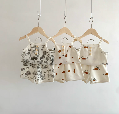 Baby waffle knit tank and shorts sets in three prints hanging on hangers