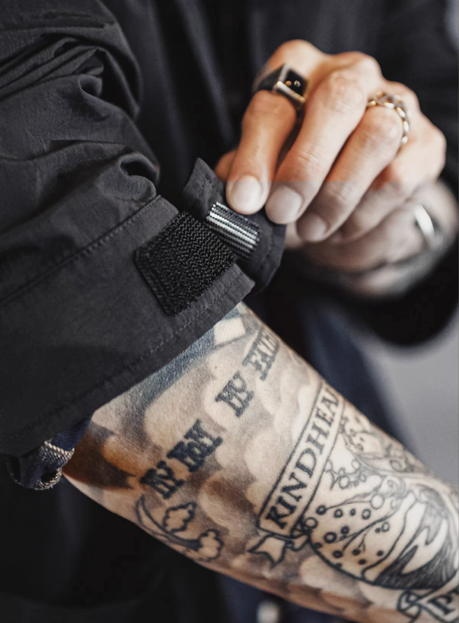 adjustable sleeve cuff with hook and loop tab