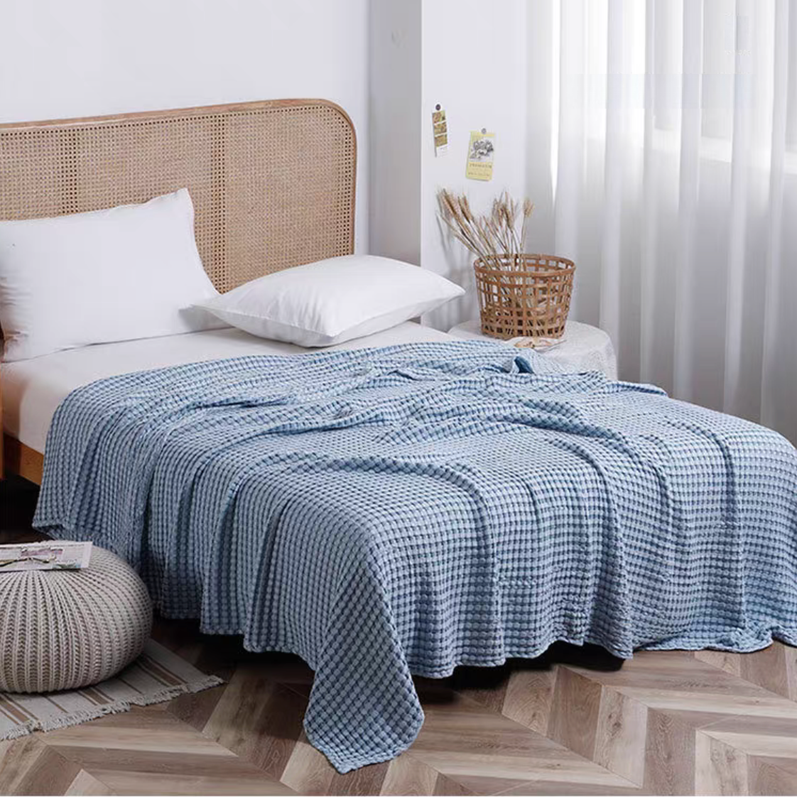 Blue bamboo cotton waffle throw blanket styled on modern bedroom bed creating breathable lightweight comfort for home decor