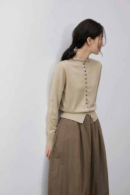 Beige wool cardigan, back view on model