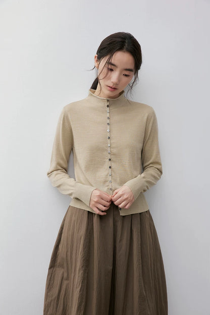 Beige wool cardigan, front view on model