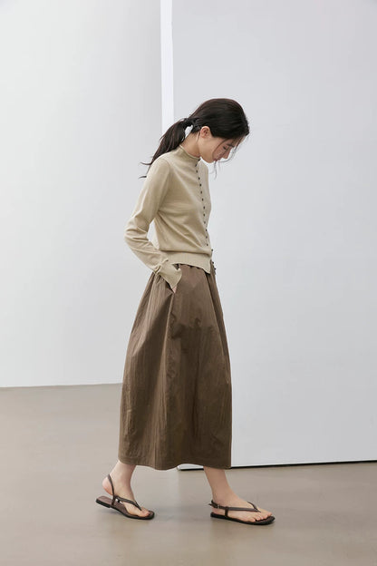 Beige wool cardigan, side view on model