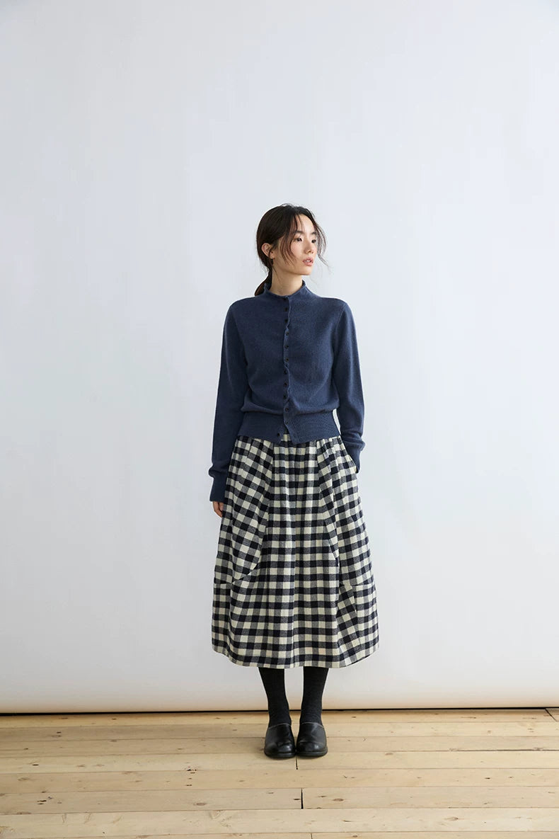 Black and cream gingham wool skirt with elastic high waist and rounded paneled seams