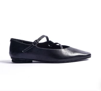 Side profile of a Black leather ballet flat with contrast topstitching and low flat heel