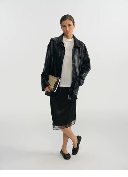 Full-length view of a black faux leather jacket falling to the hip