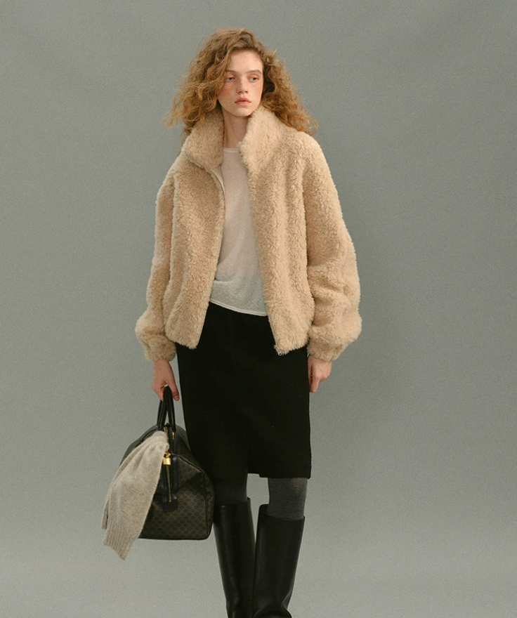 Front view of Black high-waisted wool knee skirt with front slit