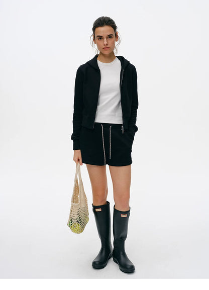Full-length front view of Black cropped zip hoodie and drawstring shorts set