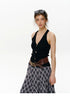 Waist-up view of Black ribbed halter vest showing plunging V-neck and gold buttons