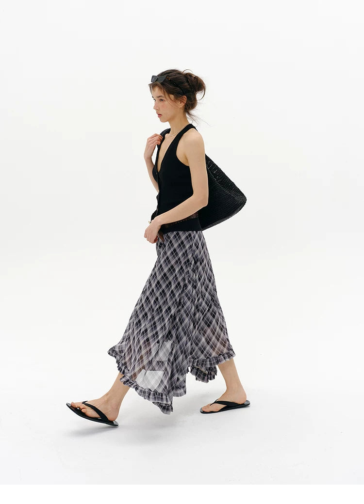 Side profile of Black wool blend halter sweater vest with deep V-neck