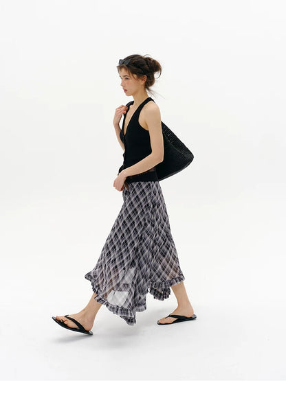Side profile of Black wool blend halter sweater vest with deep V-neck