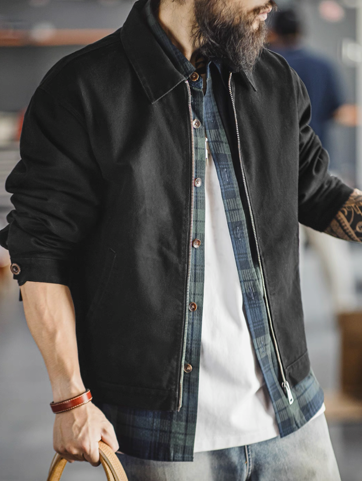 Men’s black cotton workwear jacket layered over shirt
