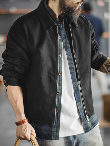Men’s black cotton workwear jacket layered over shirt