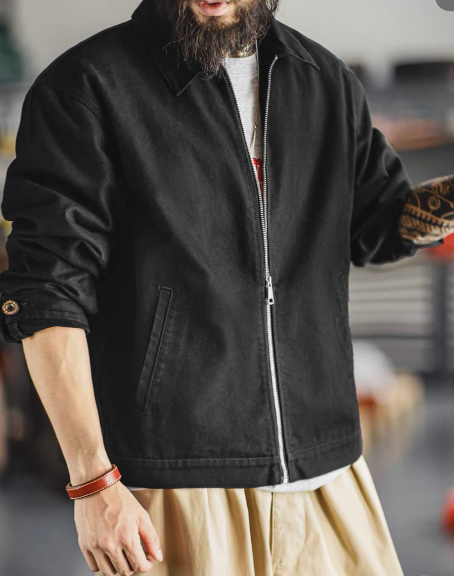 Model wearing men’s black cotton workwear jacket front view