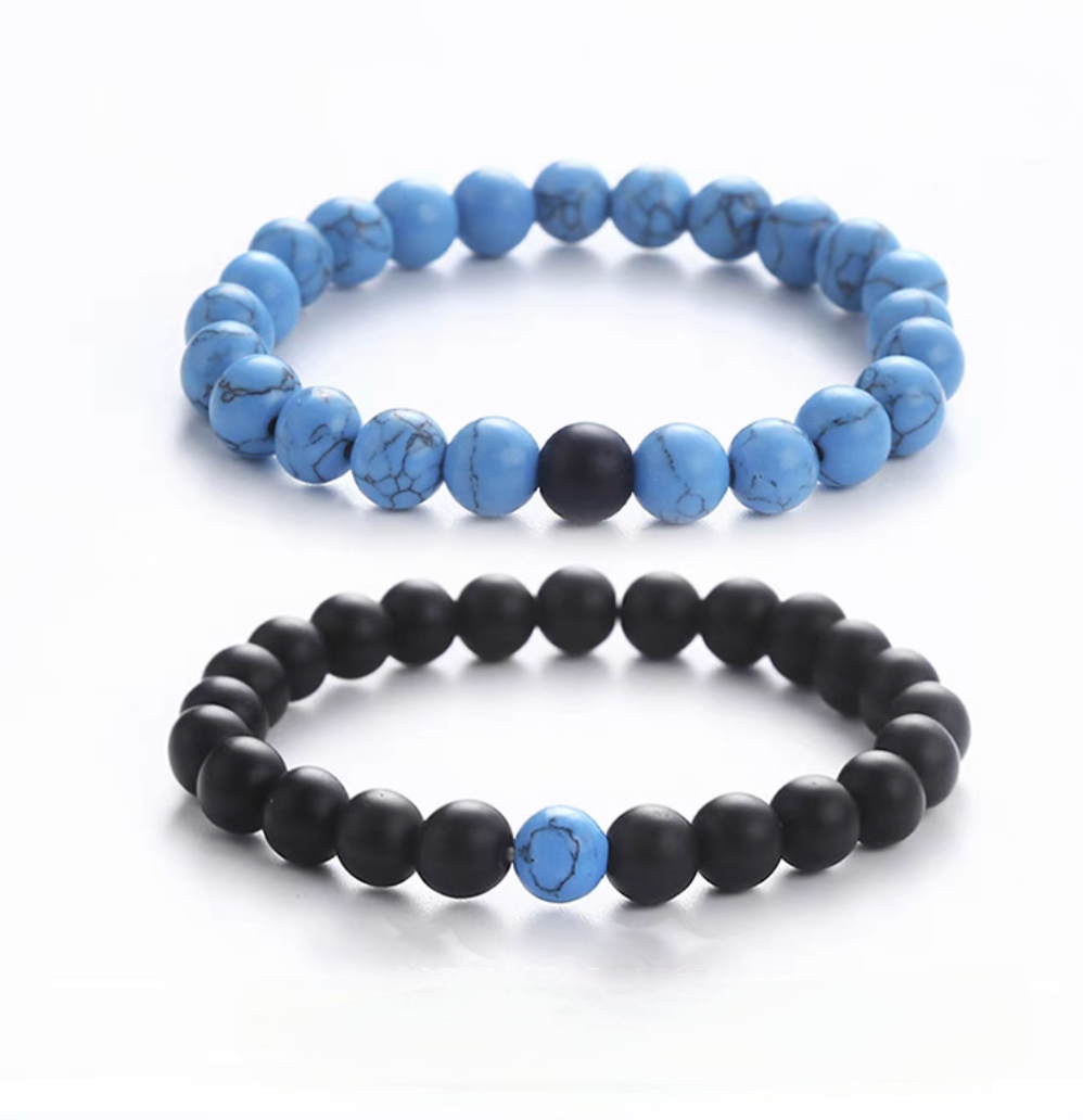 Blue turquoise and black stone minimal bead bracelet set featuring matte blue veined beads and matte black beads with contrast accent