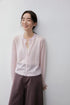 Blush Pink cashmere silk cardigan, close front view on smiling model