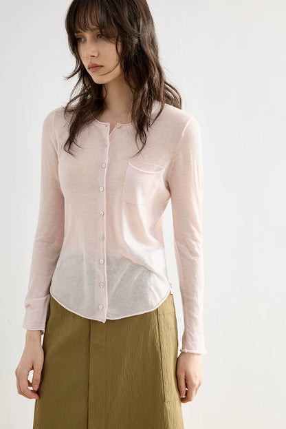 Blush Pink wool cardigan, close-up of round neckline and pearl-style buttons