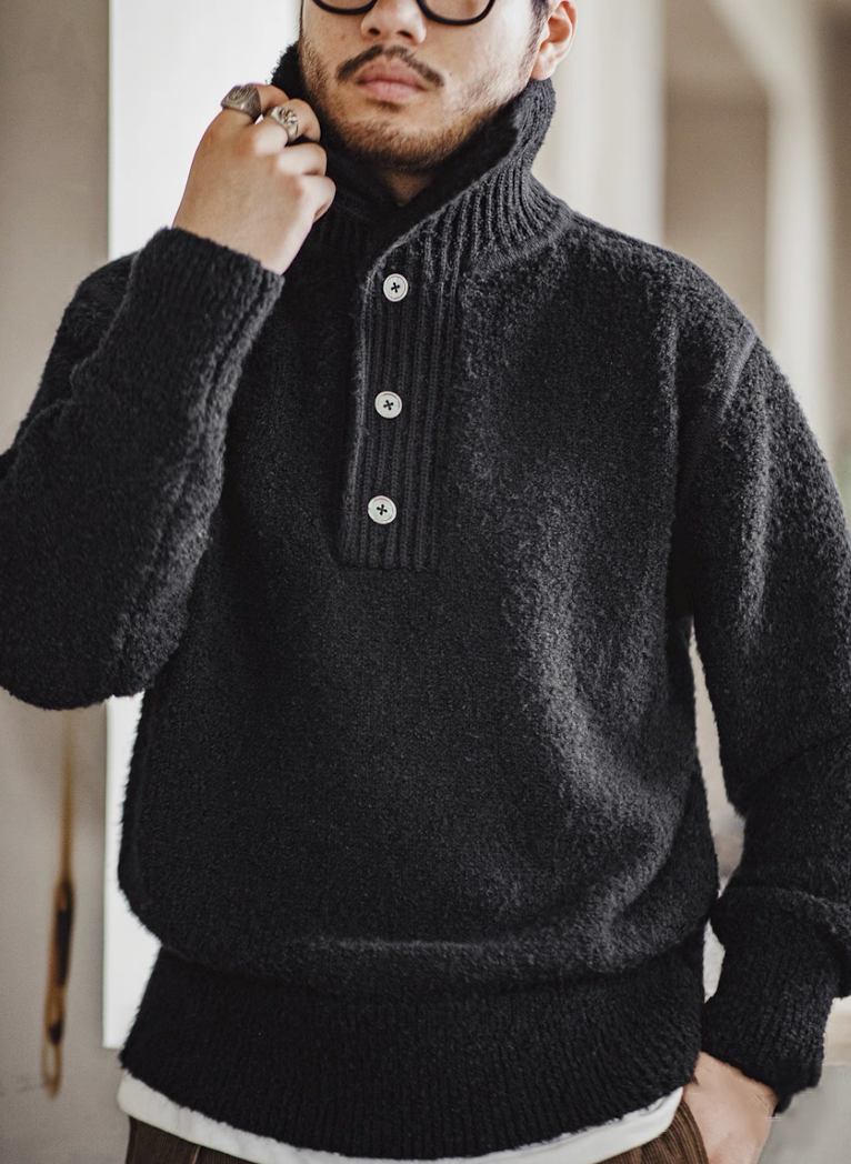 Model styling Black Bouclé Polo Sweater with raised collar close-up