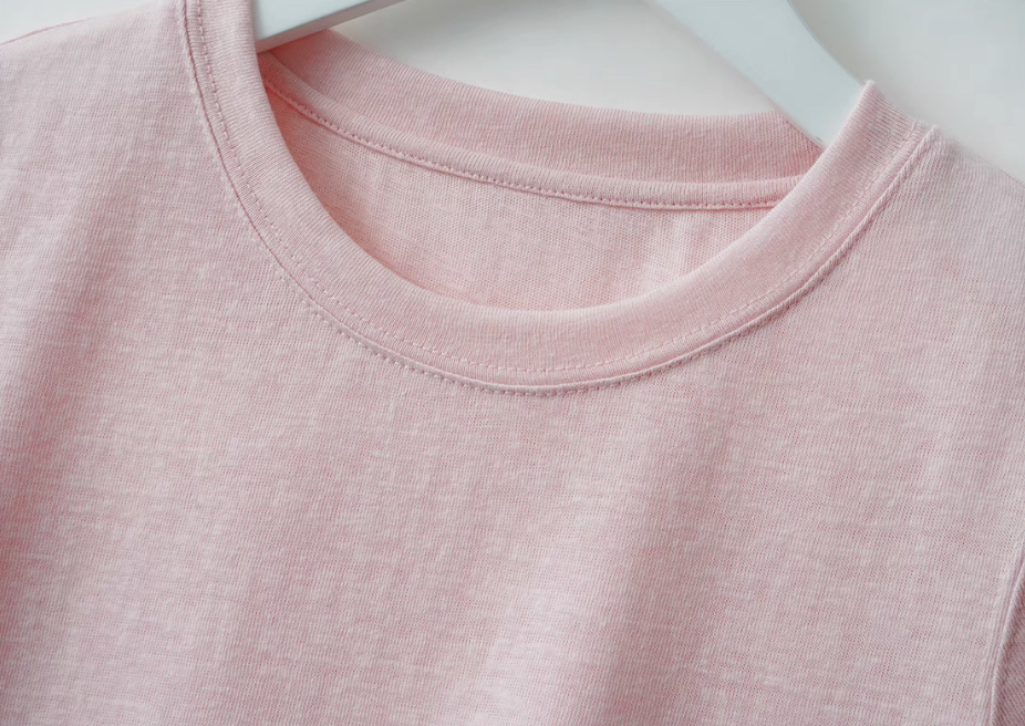 Close-up of Breeze Sheer Classic Tee in pink featuring crewneck stitching and soft slub jersey fabric texture