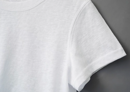 Close-up of Breeze Sheer Classic Tee in white showing slub jersey texture and soft lightweight sleeve construction