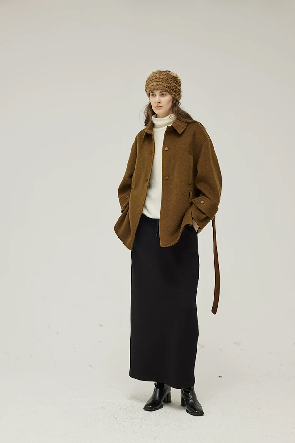 Brown short wool coat worn open with the belt hanging loose, showing the point collar and cuff tabs