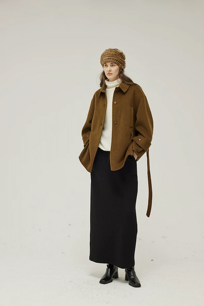 Brown short wool coat worn open with the belt hanging loose, showing the point collar and cuff tabs
