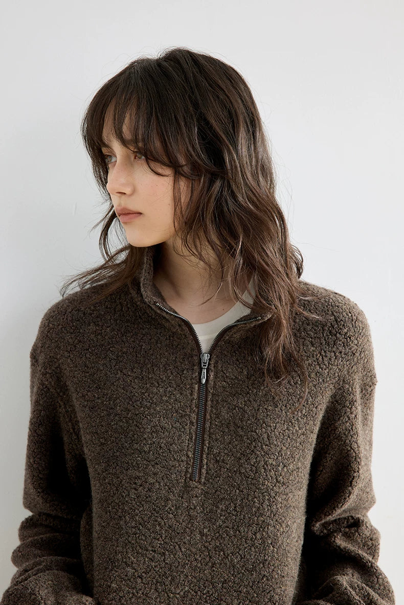 Brown bouclé wool pullover, close-up of half-zip stand collar