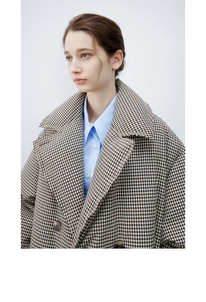 Close-up of a Brown Check down coat’s oversized notched lapels and tortoiseshell-look button