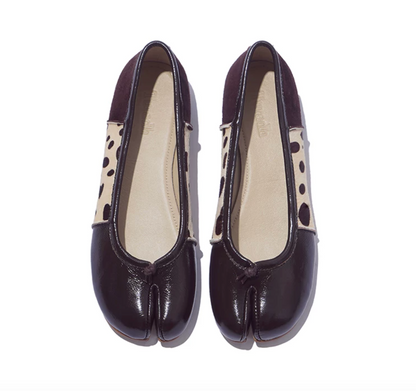 Top-down view of Brown tabi ballet flats showing the split toe, knotted tie, and patchwork upper