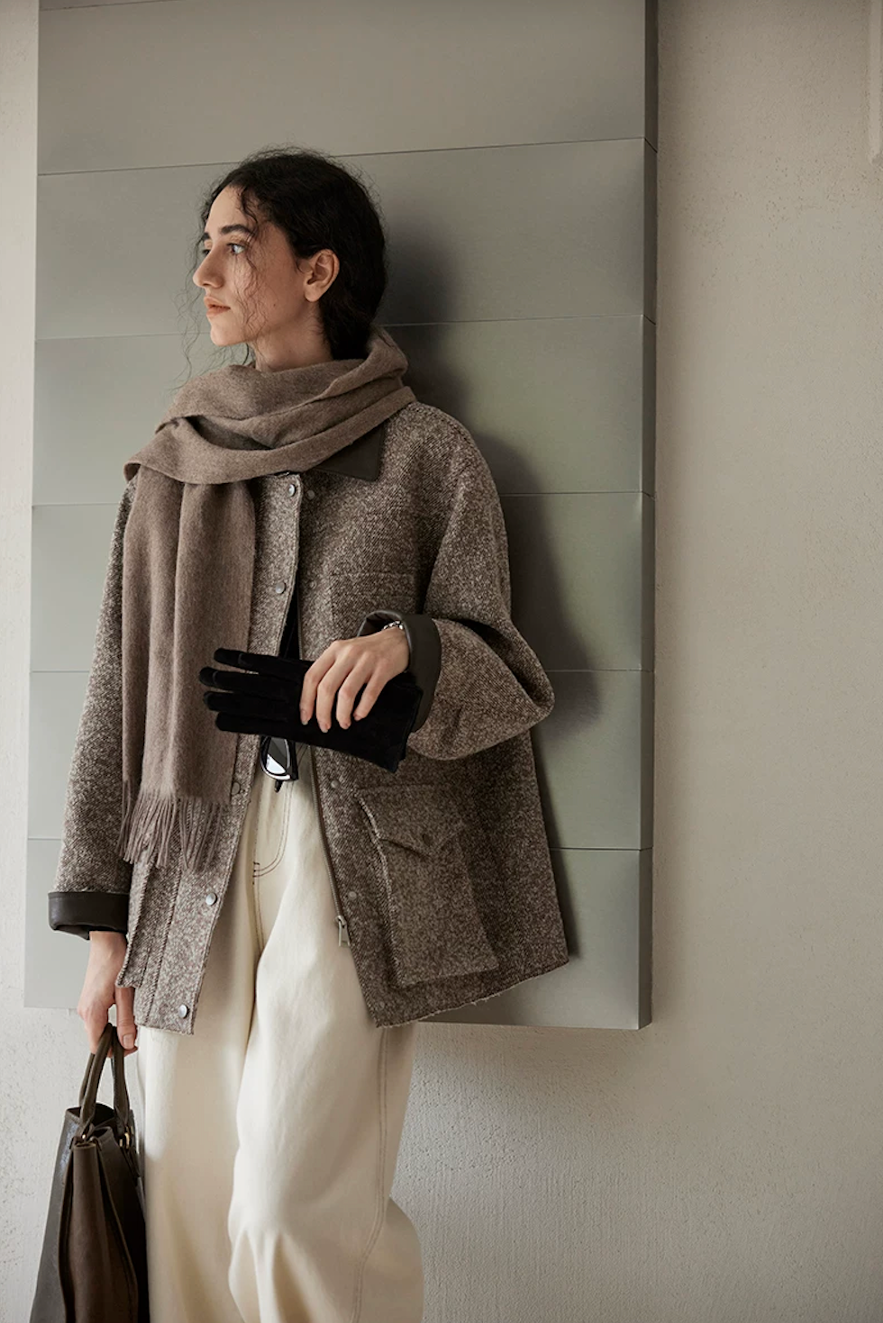 Brown wool tweed field jacket with snap front and large flap cargo pocket with raw edges