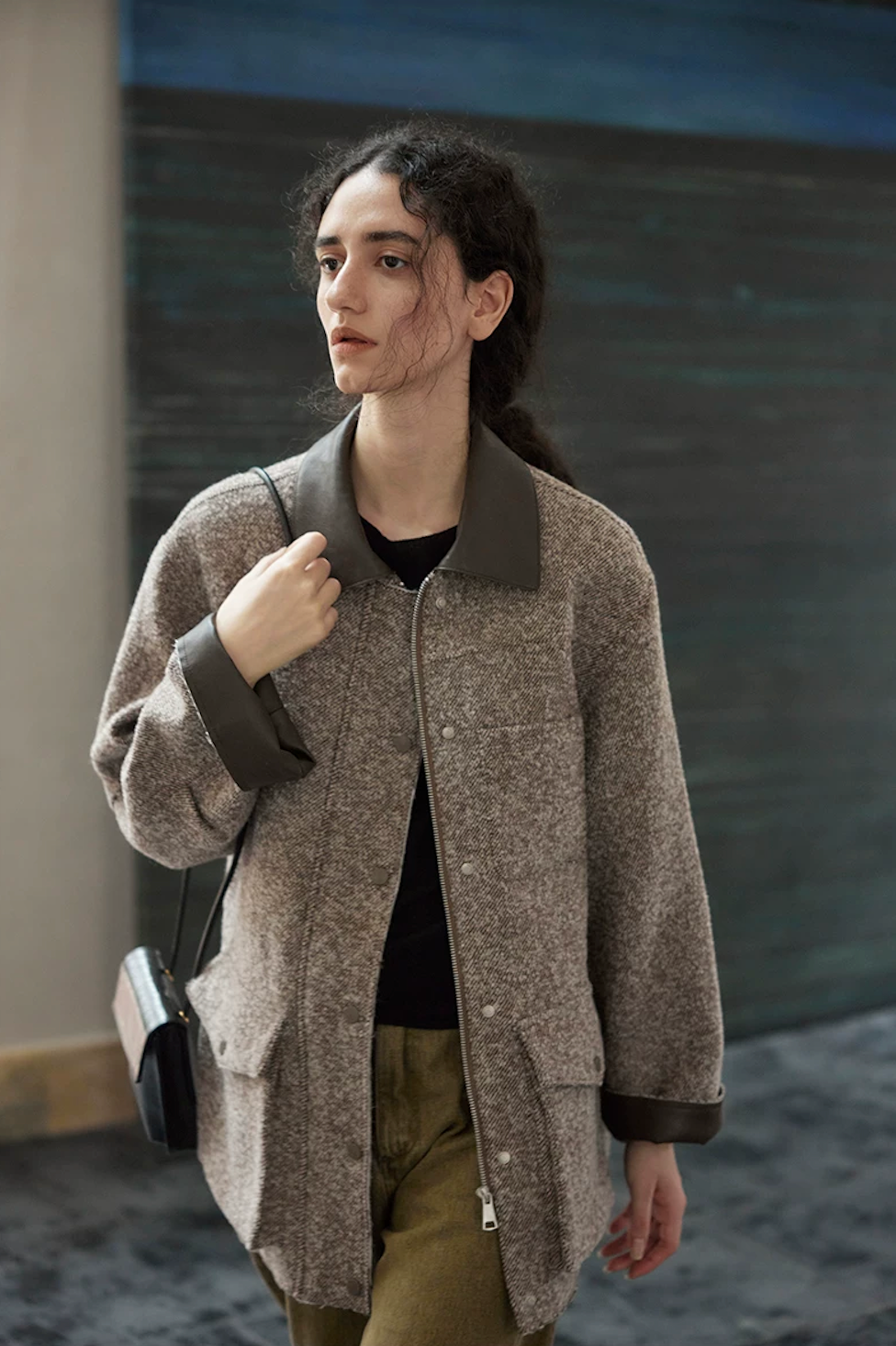 Front view of a Brown wool field jacket with zip front, flap cargo pockets, and leather-look collar