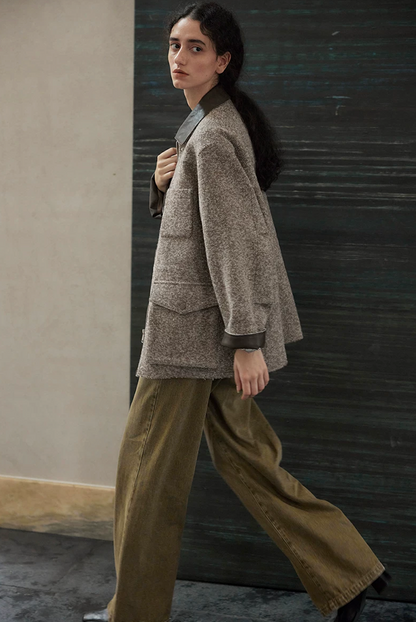 Side view of a Brown raw-edge wool jacket showing the chest patch pocket and flap cargo pocket
