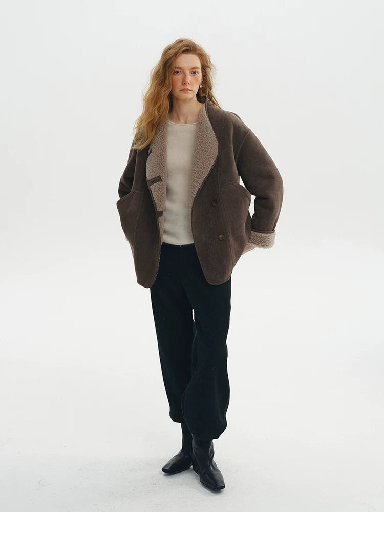 Brown oversized faux-suede jacket worn open with taupe wool lapels and rolled cuffs
