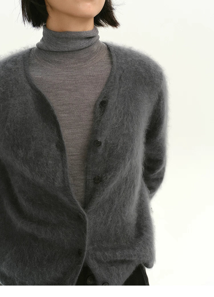 Close-up of charcoal gray brushed cashmere cardigan with soft fuzzy texture.