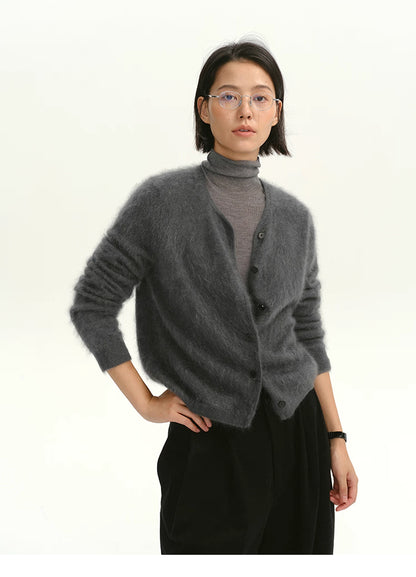 Woman wearing charcoal gray brushed cashmere cardigan layered over gray turtleneck.