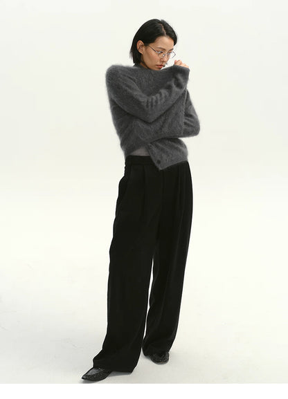Full-body shot of charcoal brushed cashmere cardigan styled with wide-leg pants.