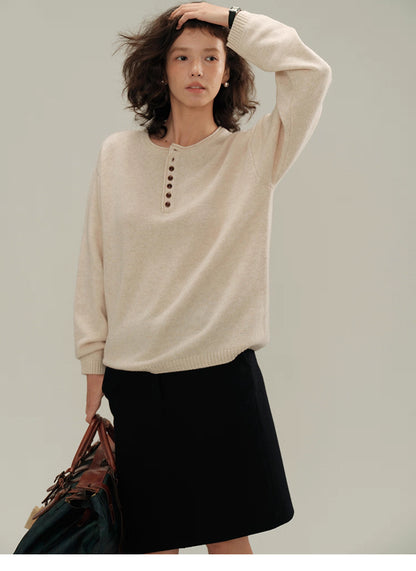 Model wearing cream almond Buttoned Henley Knit Pullover Sweater with button placket, front view