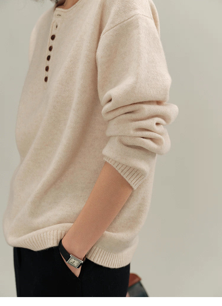 Close-up of cream almond Buttoned Henley Knit Pullover Sweater sleeve and cuff knit detail