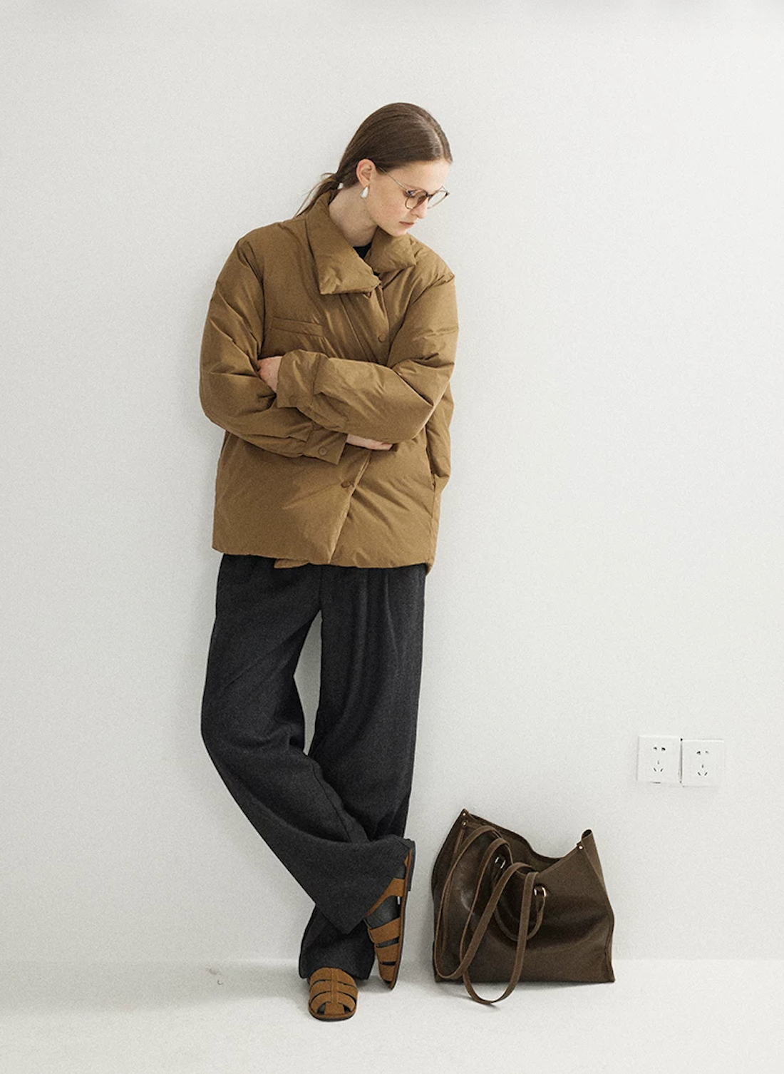 Full-length view of a Camel hip-length down jacket with convertible collar and buttoned cuffs
