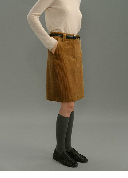 Camel corduroy skirt side view showing belt loops and a slanted side pocket