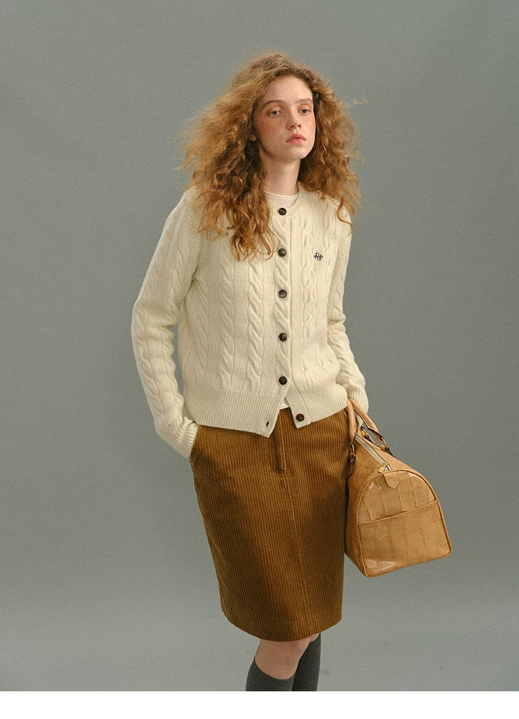 Model wearing a camel corduroy high-waisted straight skirt, front view