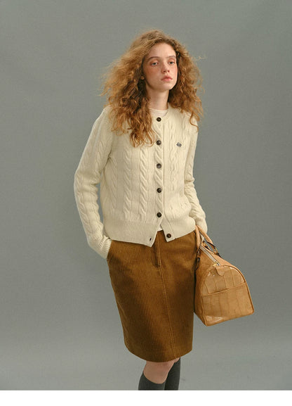 Model wearing a camel corduroy high-waisted straight skirt, front view