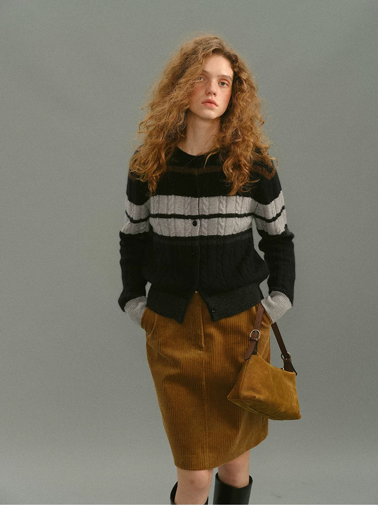 Model in a camel cotton corduroy skirt with a high rise, front view