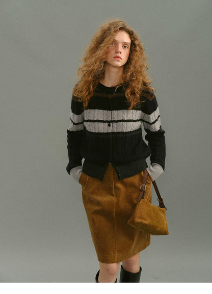Model in a camel cotton corduroy skirt with a high rise, front view