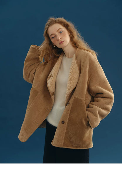 Camel faux-suede jacket worn open, showing the plush cream wool lining along the front