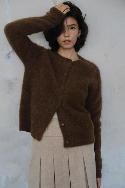 Brown fuzzy knit cardigan styled with beige pleated skirt – chic outfit