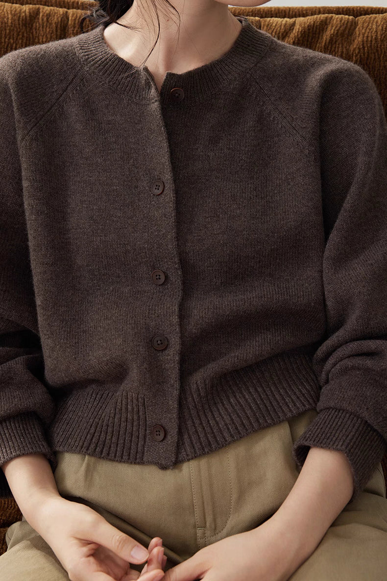 Dark Coffee Brown wool cardigan button details in seated pose