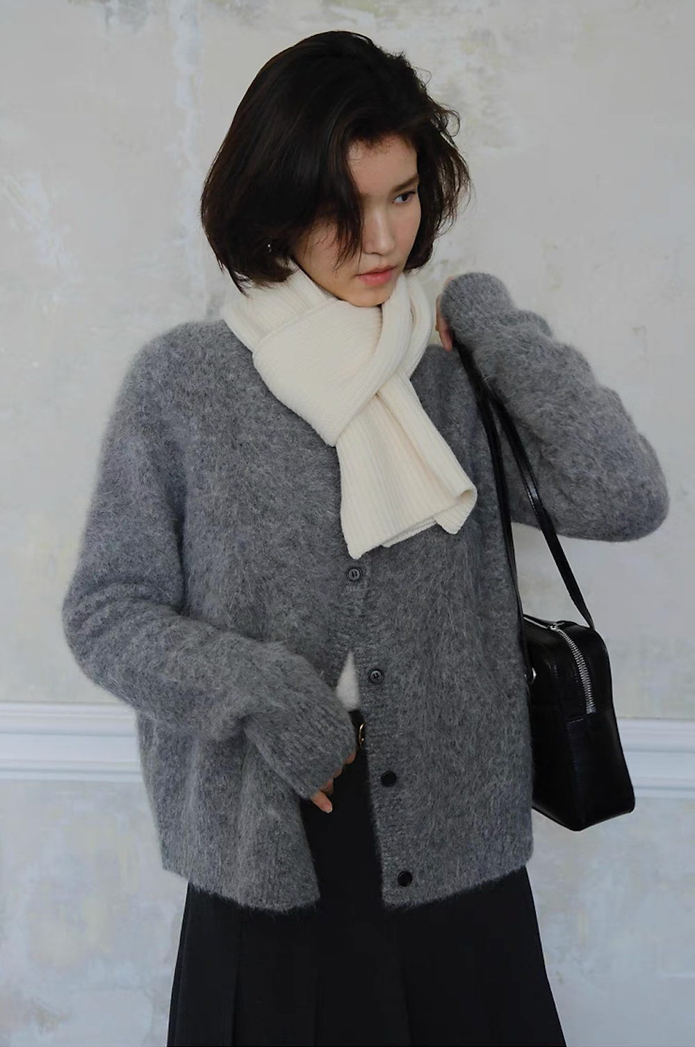 Grey cardigan styled with white scarf and black handbag, winter fashion