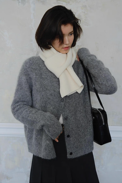 Grey cardigan styled with white scarf and black handbag, winter fashion