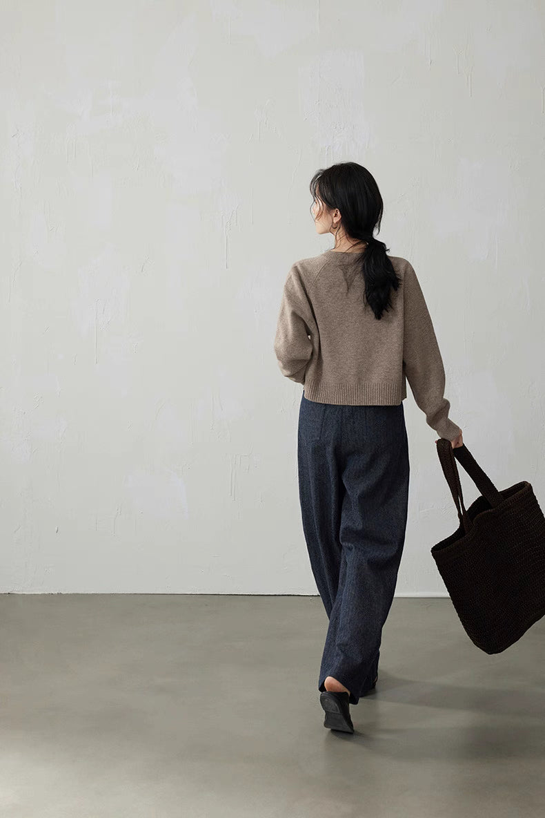 Back view of Light Brown cropped wool cardigan while walking