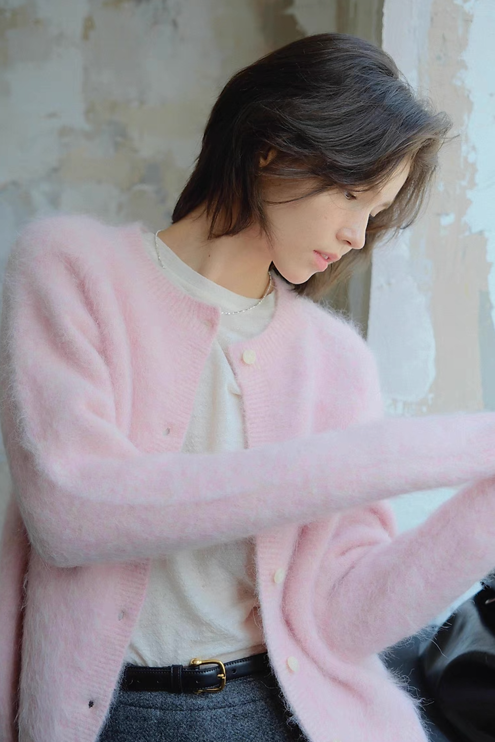 Pink fuzzy cardigan paired with white tee – cozy feminine outfit
